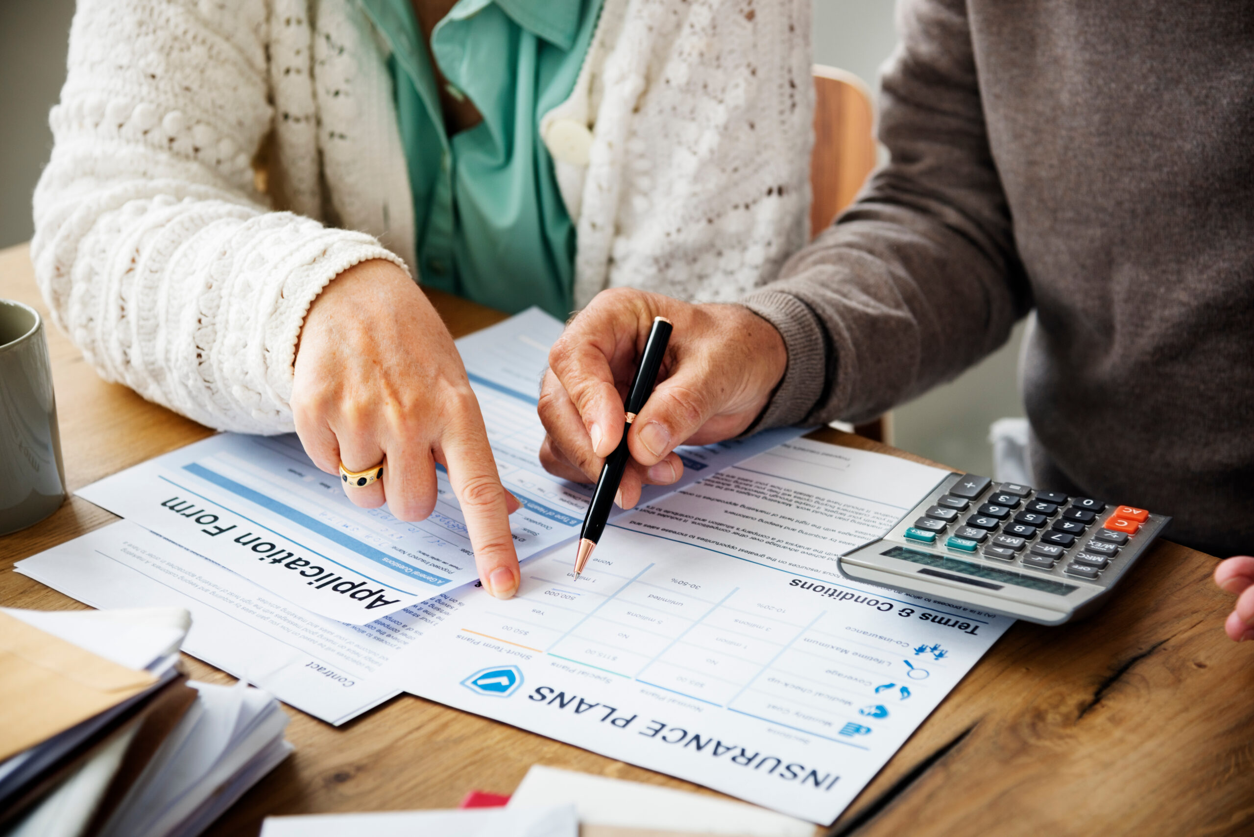 woman filling out insurance forms