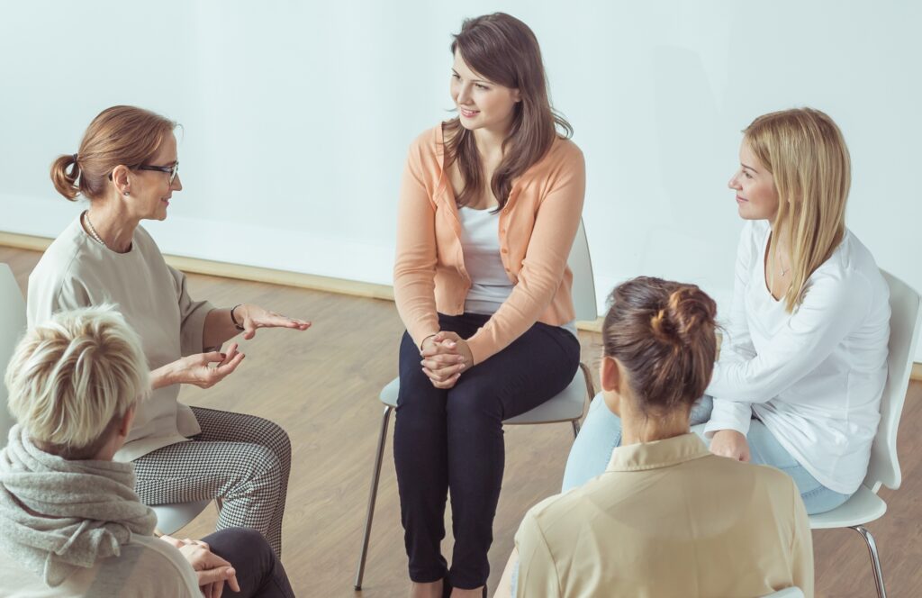 women in group therapy session