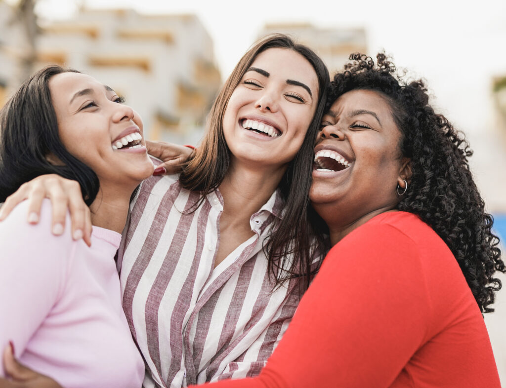 three women laughing