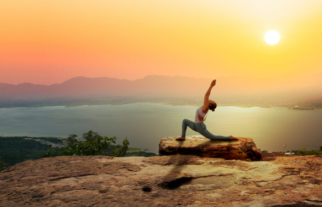 woman doing yoga on san diego beach