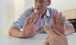 person refusing to smoke marijuana