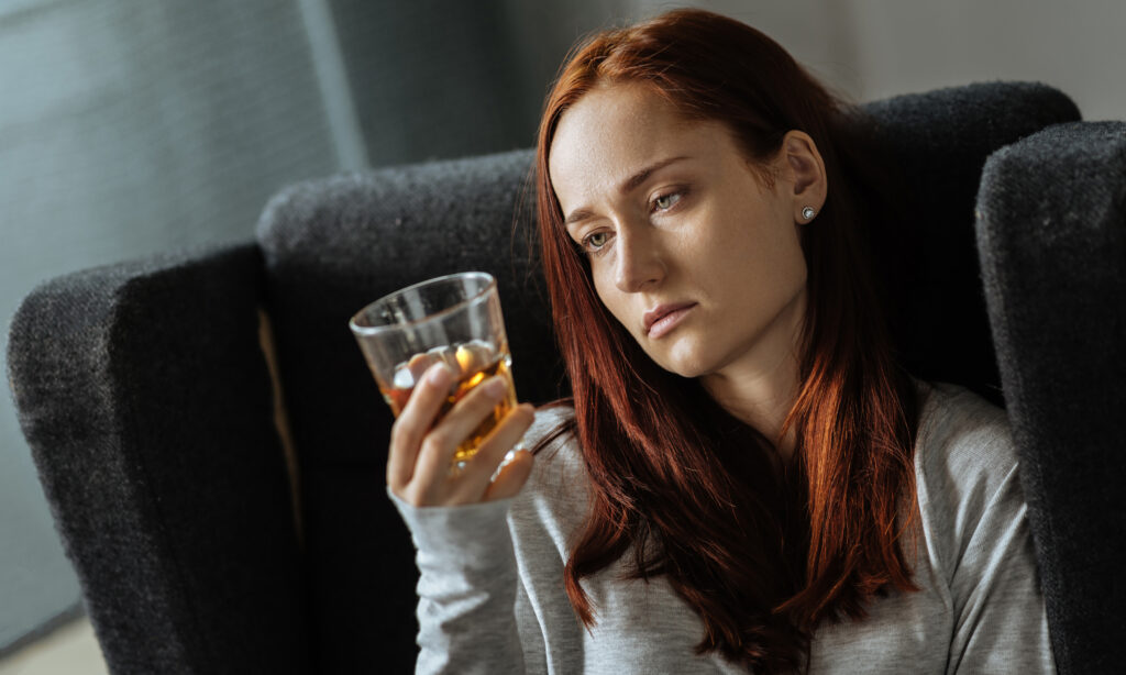 depressed woman drinking alcohol