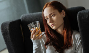 depressed woman drinking alcohol