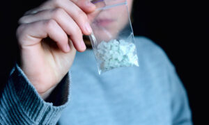 person holding meth